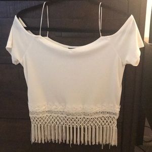 Short white top with fringe.